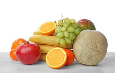 Set of fresh tropical fruits on table
