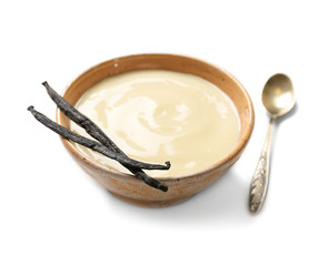Vanilla pudding and sticks on white background