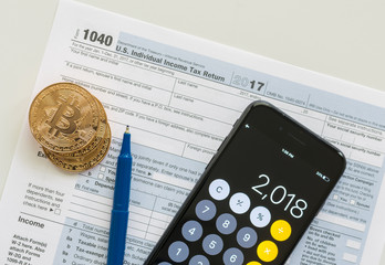 IRS 1040 tax form used to calculate capital gain or loss for bitcoin trading