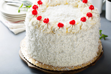 Coconut cake with maraschino cherries