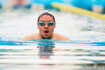 Obraz premium Portrait of young man swim in pool
