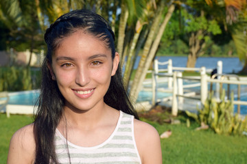 portrait of smiling girl with beautiful eyes at a park 