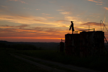 woman playing cello music in a sunset 