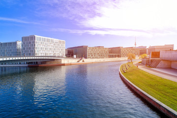 Street view of modern buildings and the Spree River in Berlin, Germany
