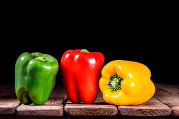 still life of three color peppers