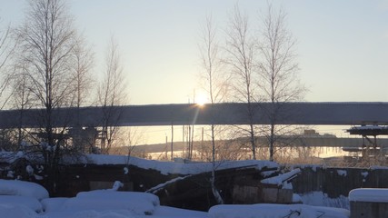 Construction of the highway in the rays of the rising sun.