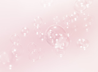 Absrtract bright soap bubbles float on pink background