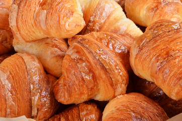 Closeup of a heap of croissants       