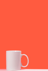 Cup white coffee on colored background with space for text