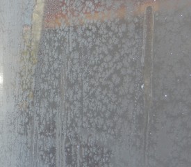 The texture of the snow with sand.