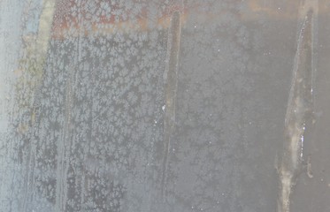 The texture of the snow with sand.