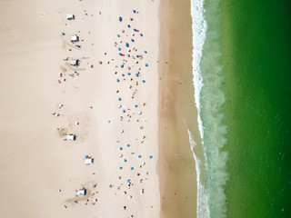 Fototapeta na wymiar Aerial view of Copacabana beach during summer, sun with clouds
