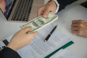 Businessman get dollar money bribery in office. corruption concepts.