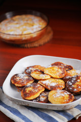 Top view of homemade cottage cheese pancakes- syrniki in a plate