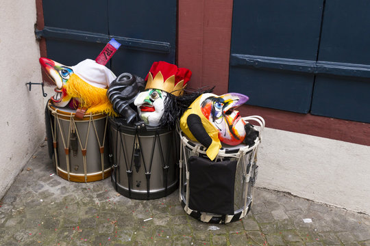 Basel carnival 2018. Pfeffergaesslein, Basel, Switzerland - February 19th, 2018. Close-up of a pile of carnival masks and snare drums in the corner of the street