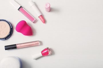 Obraz na płótnie Canvas female pink cosmetics, top view