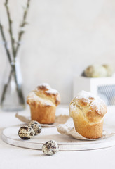 Easter eggs on the table with a top and pastries. Vertical. Close up. Selective focus.