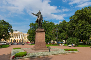 RUSSIA, SAINT PETERSBURG - AUGUST 18, 2017: Monument to the great russian poet Alexander Pushkin on Arts Square and The State Russian Museum of His Imperial Majesty Alexander III on background