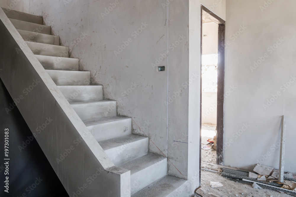 Wall mural cement concrete stair in the under construction house at building site