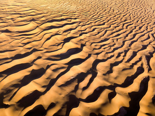 Fototapeta na wymiar Aerial top view on sand dunes in desert