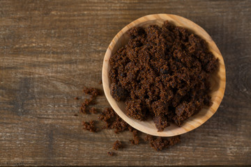 molasses sugar on wooden surface