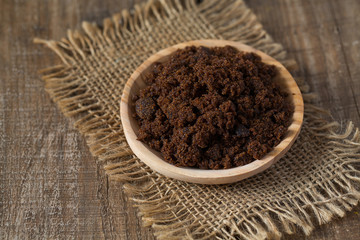 molasses sugar on wooden surface