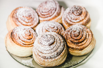  ruddy buns sprinkled with powdered sugar