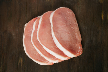 raw pork on wooden surface