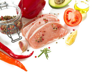 sliced raw meat and vegetables isolated on white