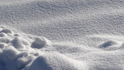 The texture of snow in the light of the rising sun.