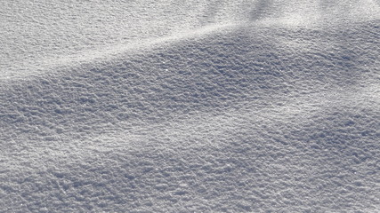 The texture of snow in the light of the rising sun.