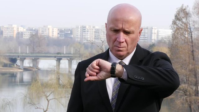 Worried Businessman Before a Business Meeting Check Impatient His Hand Watch