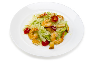 Seafood.Salad with shrimps in a plate on a white background