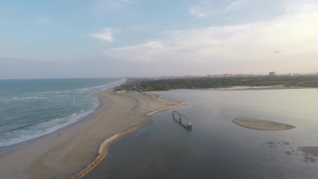 Aerial view of a beach with a bridge, India.