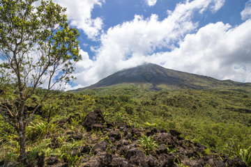 Arenal Volcano in Costa Rica with its peak shrouded in light clouds