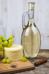 White wine, cheese and grapes
