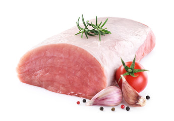 Raw pork loin with tomato, pepper, rosemary and garlic isolated on white background. Fresh meat.