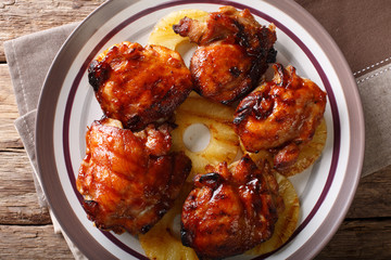 Hawaiian chicken huli huli with pineapple close-up. horizontal top view