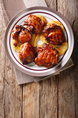 Hawaiian BBQ huli huli: Grilled chicken glazed with pineapple close-up. Vertical top view
