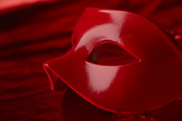 red mask with ribbons