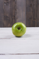 green apple on wooden background