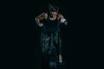 Young woman does calorie assault exercise