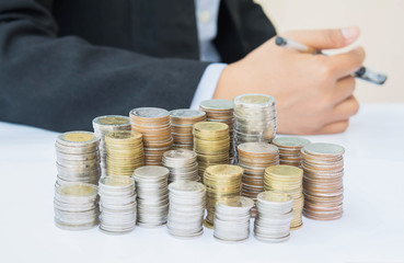 Numerous coins on the desk.