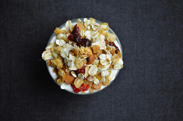 Top view photo Granola or muesli with yogurt, whole grain, almond, corn flake, cereal flake, oat and die tomato, healthy food 