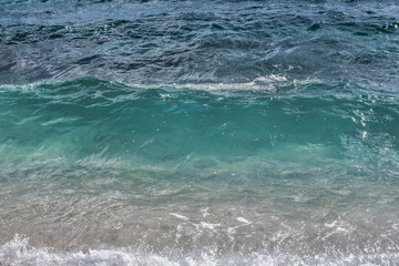 View from the beach at blue sea with little wave background