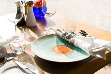 Table set for dining at restaurant at beach