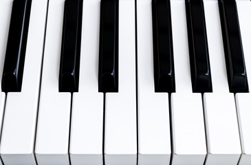 Top view of piano keys. Close-up of piano keys. Close frontal view. Piano keyboard with selective focus. Diagonal view. Piano keyboard perspective