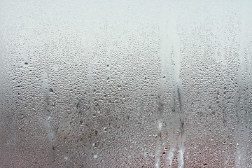 Water droplets condensation background of dew on glass window, humidity and foggy blank background. Outside the window, bad weather, rain - obrazy, fototapety, plakaty