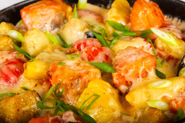 Baked salmon with potato in pan