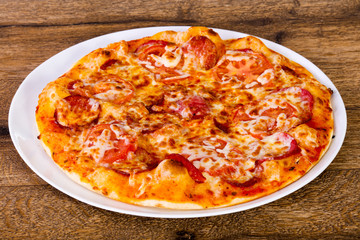 Pepperoni pizza with sausages